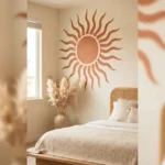 Finished terracotta boho sun wall mural painted above a bed
